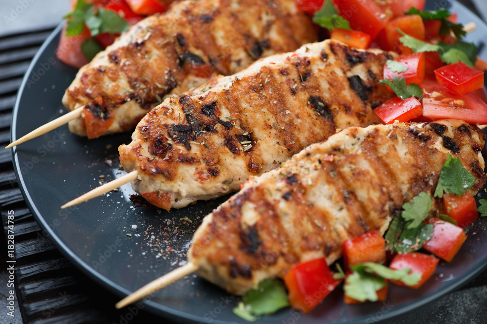 Closeup of roasted lula kebabs with chicken meat, selective focus, studio shot