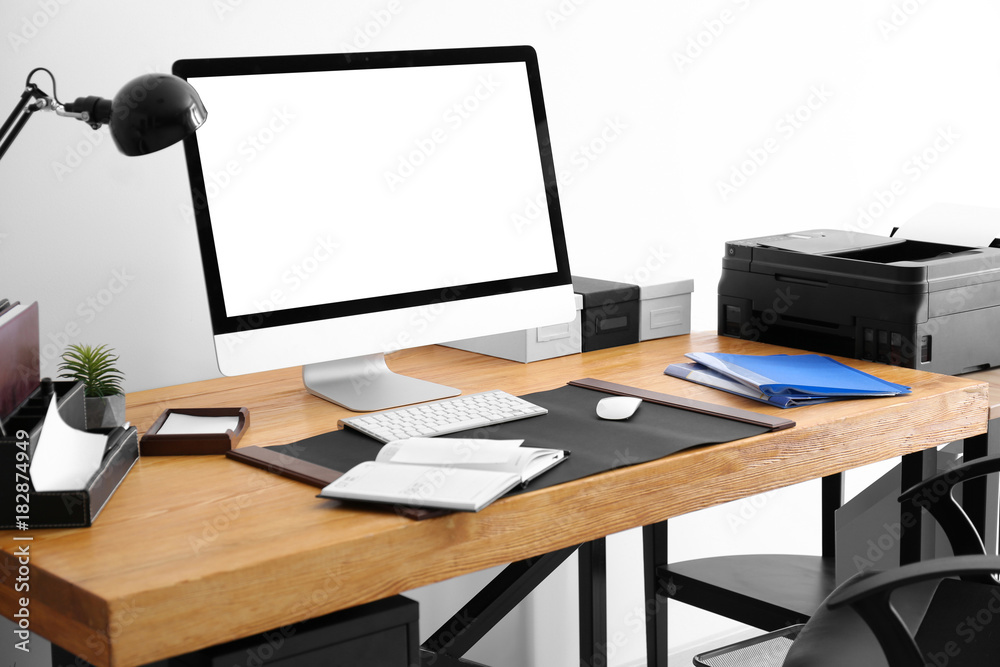 Fototapeta premium Comfortable workplace with computer monitor on table in office