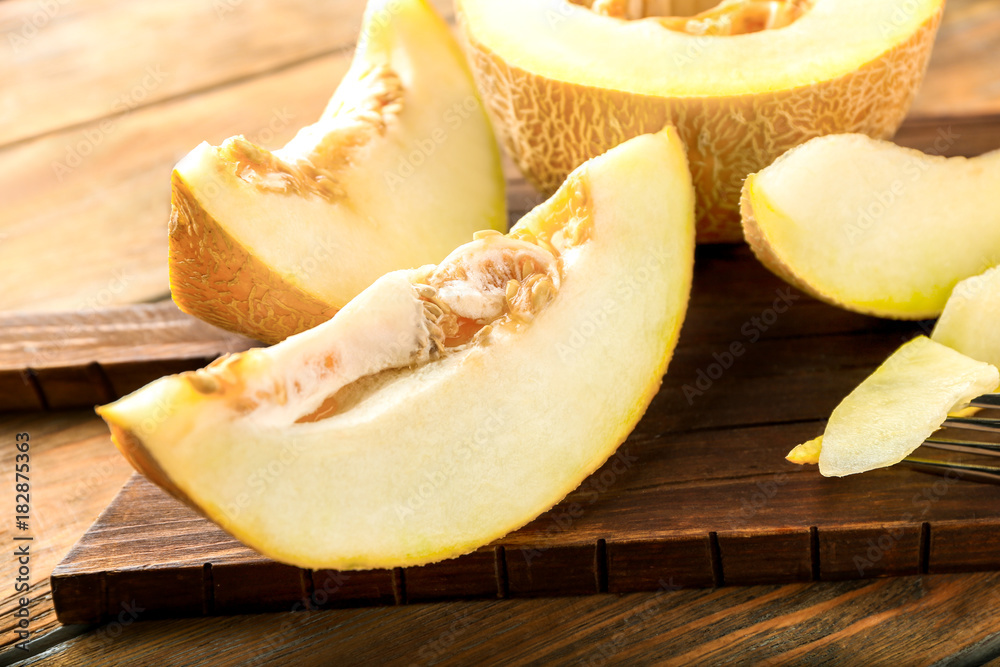 Ripe yummy melon on wooden board Ripe yummy melon on wooden board