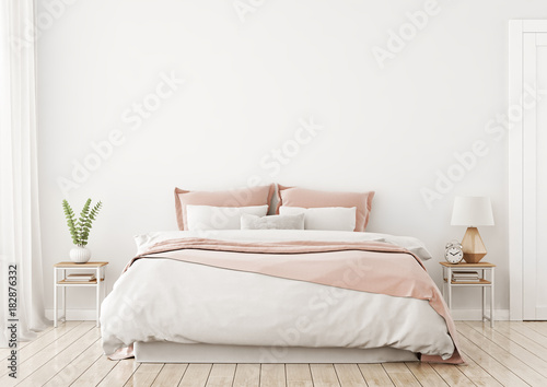 Fotografie, Obraz Light, cute and cozy home bedroom interior with unmade bed, pink plaid and cushions on empty white wall background