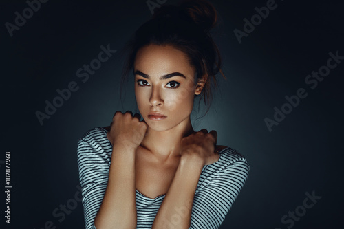 Beauty portrait of young woman in studio