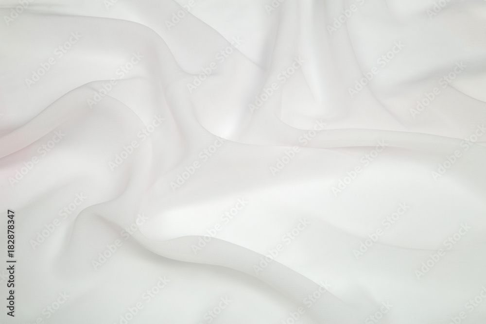 Obraz premium bright white square light fabric spread out in soft folds on the table