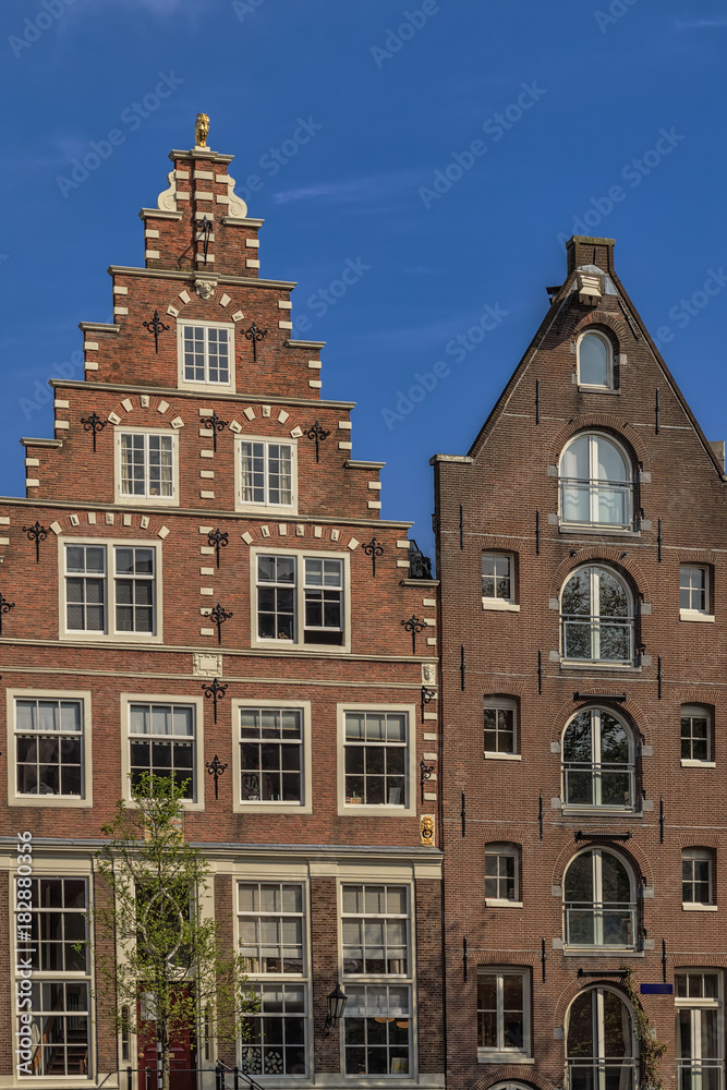 Fototapeta premium Traditional old buildings in Amsterdam.