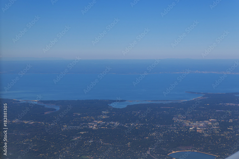 Obraz premium View from the airplane window, New York view of the ocean and also the coast from the altitude of the aircraft