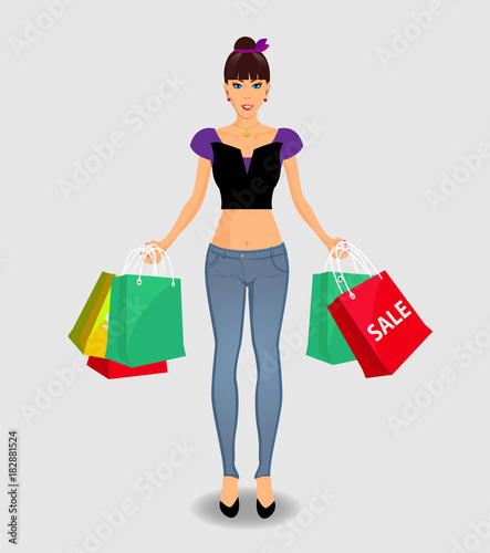 woman in jeance and top holding colored shopping bags