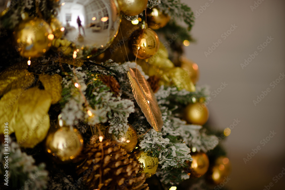 Gold Christmas de-focused lights with decorated tree Gold Christmas de-focused lights with decorated tree