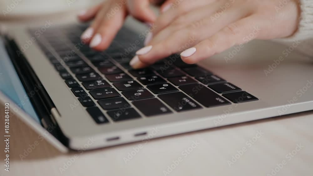 Closeup of business woman typing on laptop. Female hands busy typing on keyboard. Freelancer girl working at home in winter. Slow motion. Camera rotating, dolly Closeup of business woman typing on laptop. Female hands busy typing on keyboard. Freelancer girl working at home in winter. Slow motion. Camera rotating, dolly