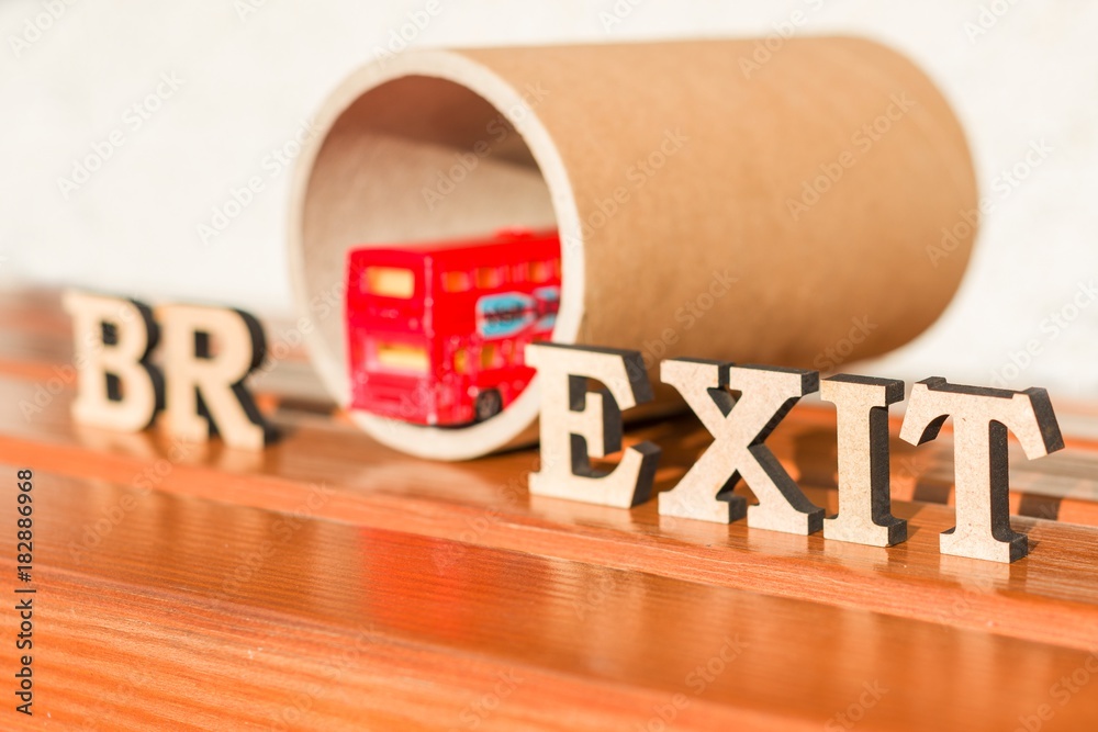 Britain exit from European Union, Brexit word abstract in vintage letters,background double decker bus toy model, tunnel
