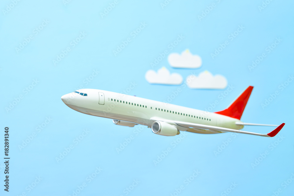 white airplane on a blue white airplane on a blue