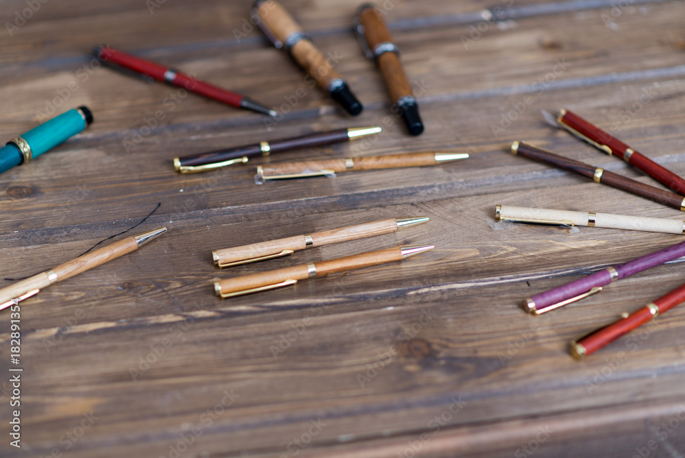 wooden writing pens on a wooden table wooden writing pens on a wooden table