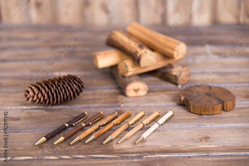 Fototapeta Naklejka Na Ścianę i Meble -  wooden writing pens on a wooden table