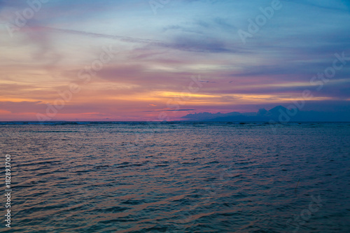 Beautiful sunset over the sea and volcano Agung silhouette on the island of Gili Trawangan  Indonesia