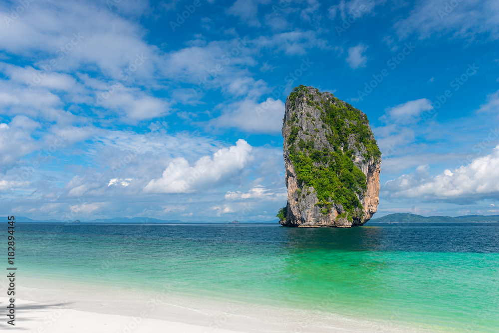 high cliff in the turquoise sea, a postcard view from the island of Poda on a clear sunny day