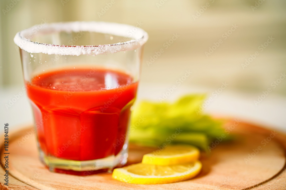 Bloody Mary alcoholic drink with lemon and celery Bloody Mary alcoholic drink with lemon and celery