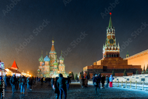Spasskaya tower of the Kremlin and St. Basil's Cathedral in the winter New Year's Eve