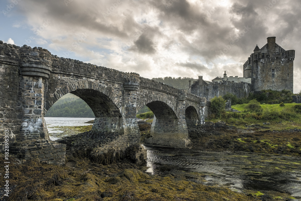 A dreamy Scottish castle with an old stone bridge