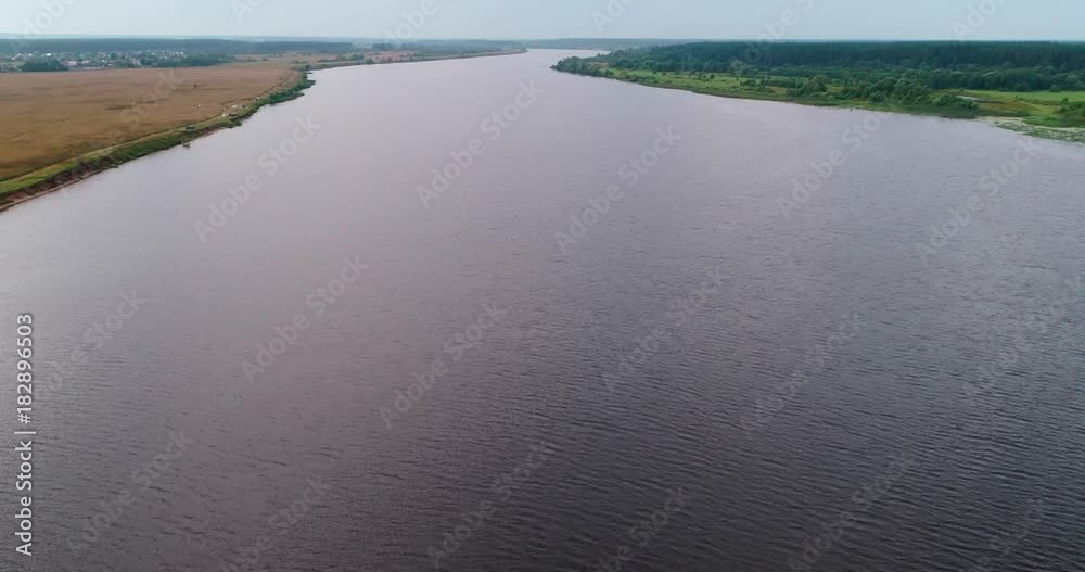 Volga river aerial view from flying quadcopter over forest. Landscape panorama. Beautiful nature. Horizon in the background of fields of meadows and sky. Volga river aerial view from flying quadcopter over forest. Landscape panorama. Beautiful nature. Horizon in the background of fields of meadows and sky.
