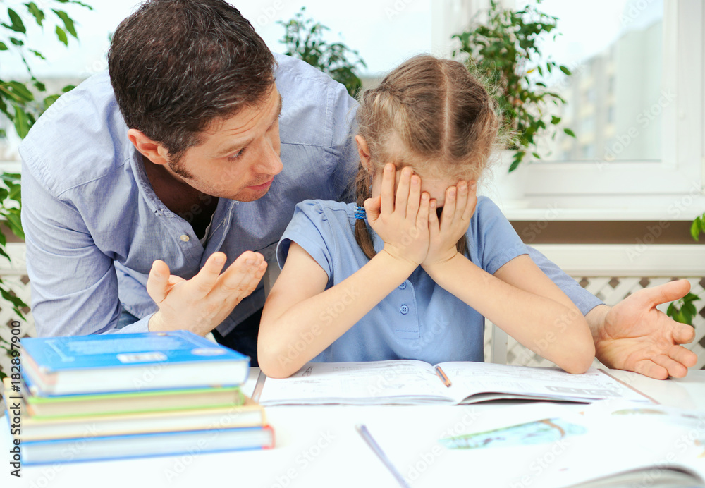 Dad is angry because his daughter don't want to do her homework. Dad is angry because his daughter don't want to do her homework.