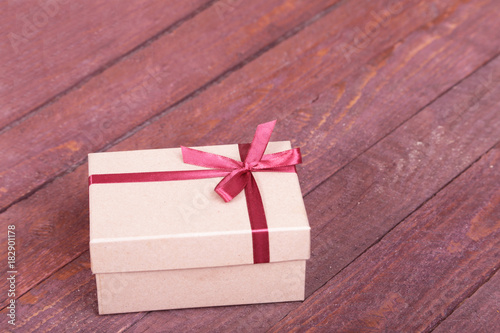 Gift boxes with bow on wood background