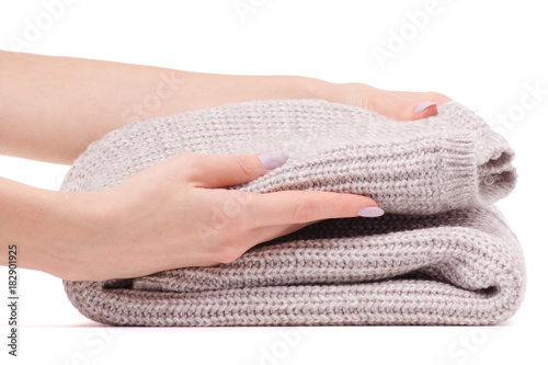 Warm sweater beige folded female hand
