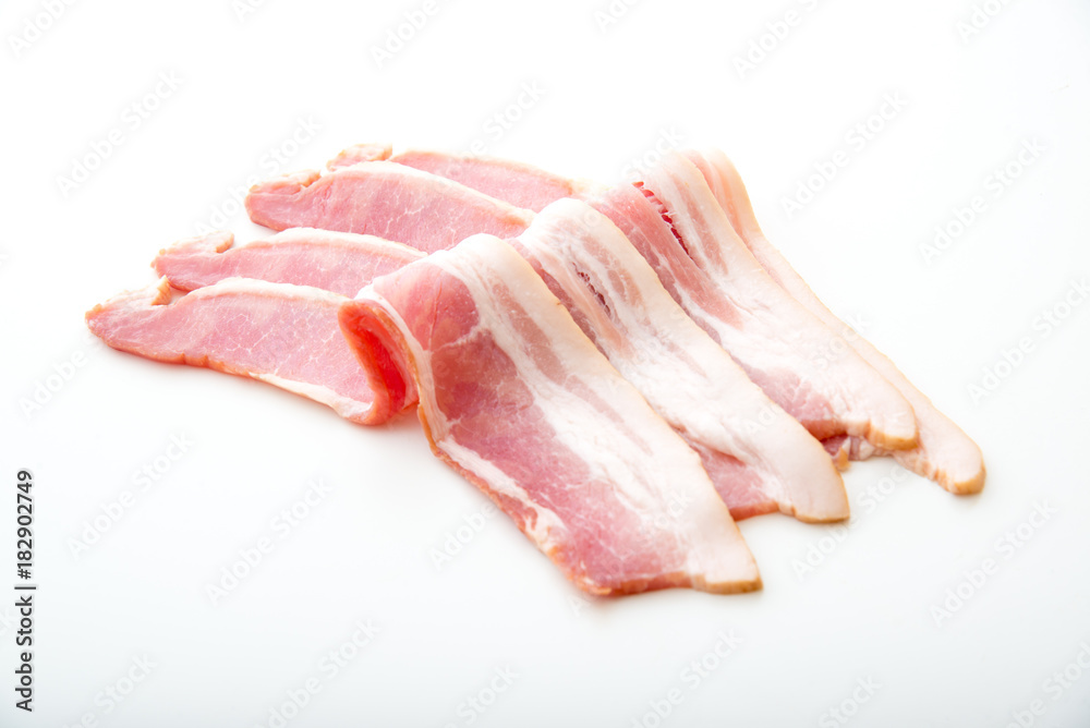 isolated raw bacon on white background