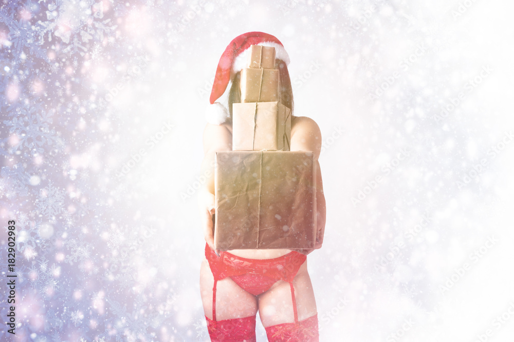 Christmas New Year concept of selling gifts. Model XXL in lingerie with  presents. Fat woman in