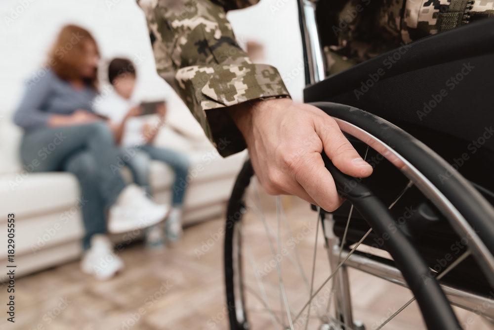 Obraz premium Veteran in wheelchair returned from army. Close-up photo veteran in a wheelchair.