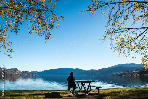Girl looking at the Okanagan Lake in Peachland British columbia Canada