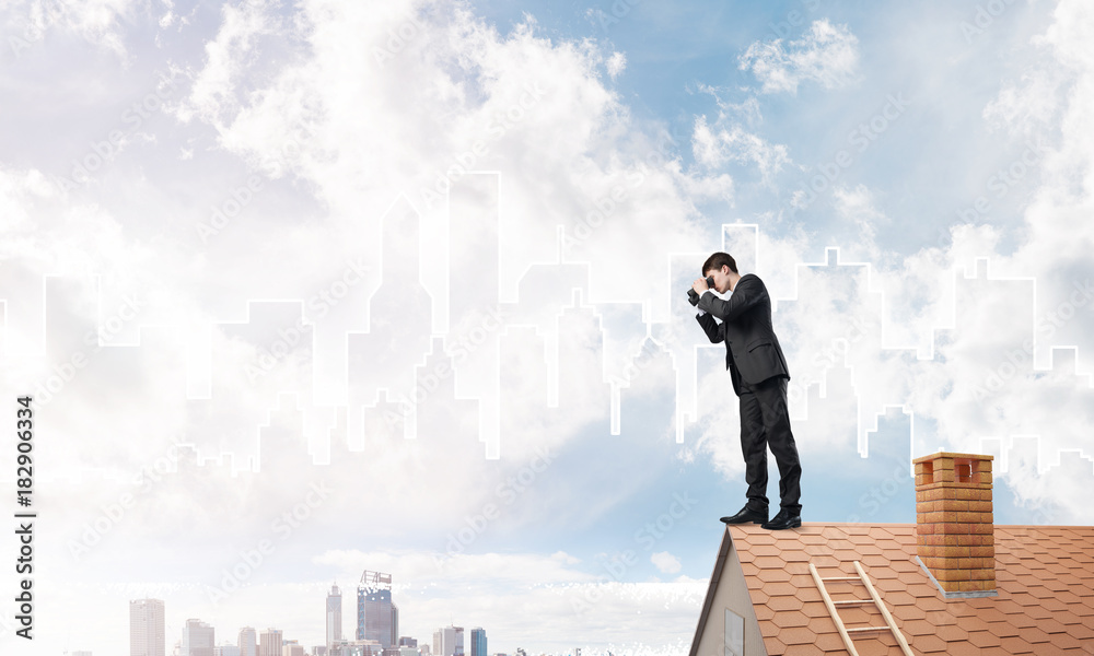 Businessman standing on roof and looking in binoculars. Mixed media Businessman standing on roof and looking in binoculars. Mixed media