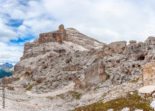Panorama of Cantore mountain hut and first world war ruines in the middle of expanse of cyclopean boulders near Fontananegra Pass, theater of fierce fighting in 1915 - 16, Tofane, Dolomites, Italy