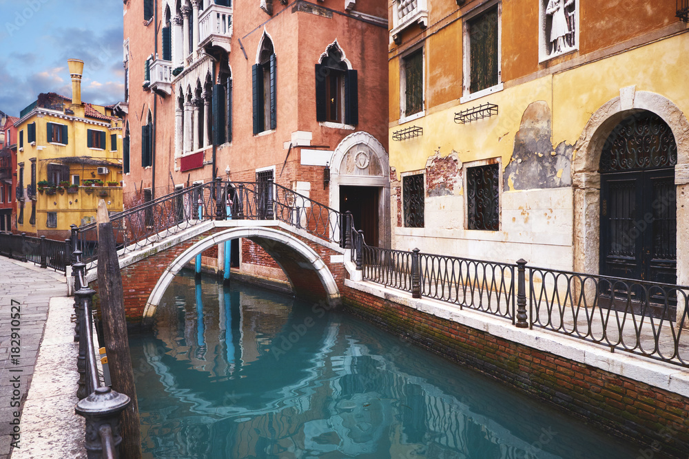 Old houses and bridge over canal in central Venice