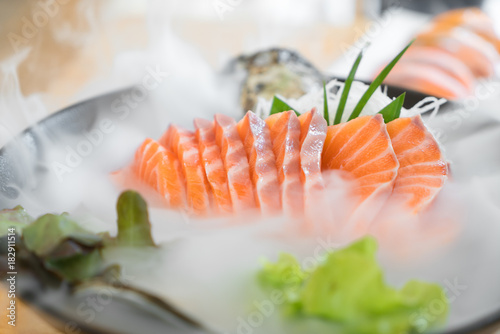 Japan raw salmon slice or salmon sashimi in Japanese style fresh serve on ice in Japanese restaurant.