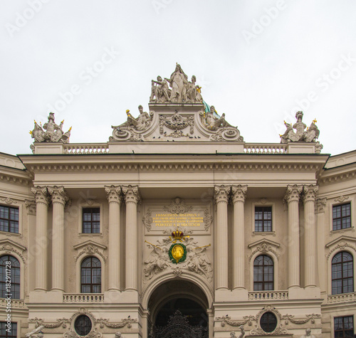 Vienna, Austria- December 31, 2013: Hofburg Palace seen from Michaelerplatz, with tourists and people.Vienna.Austria.