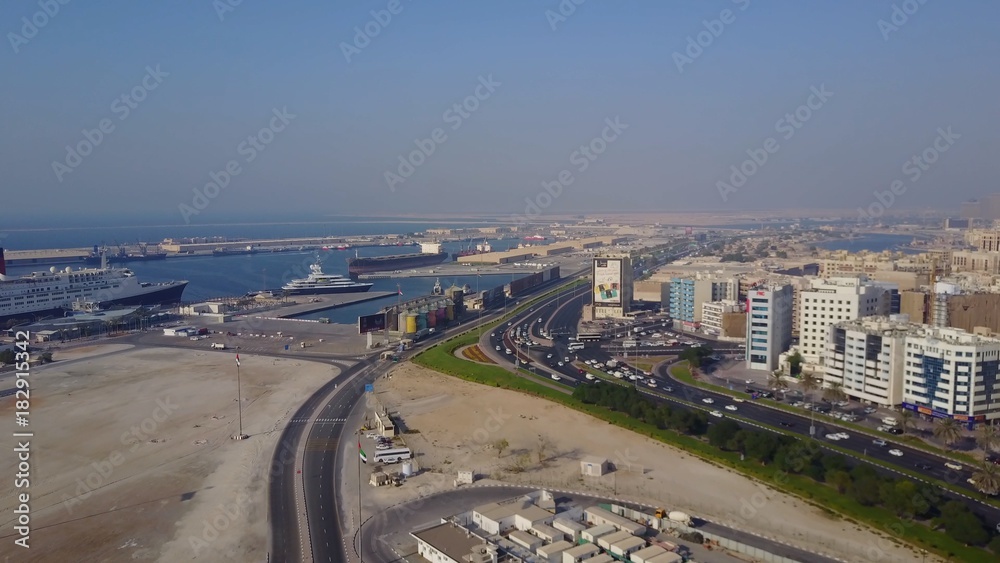 Highway on Dubai. Aerial view of The World Islands in Dubai. The islands were intended to be developed with hotel complexes and luxury villas, like The Palm is