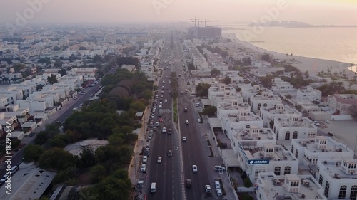 Traffic on highway Sheikh Zayed Road leading to the city center aerial view. Dubai, United Arab Emirates. Top view of highway interchange in Dubai photo