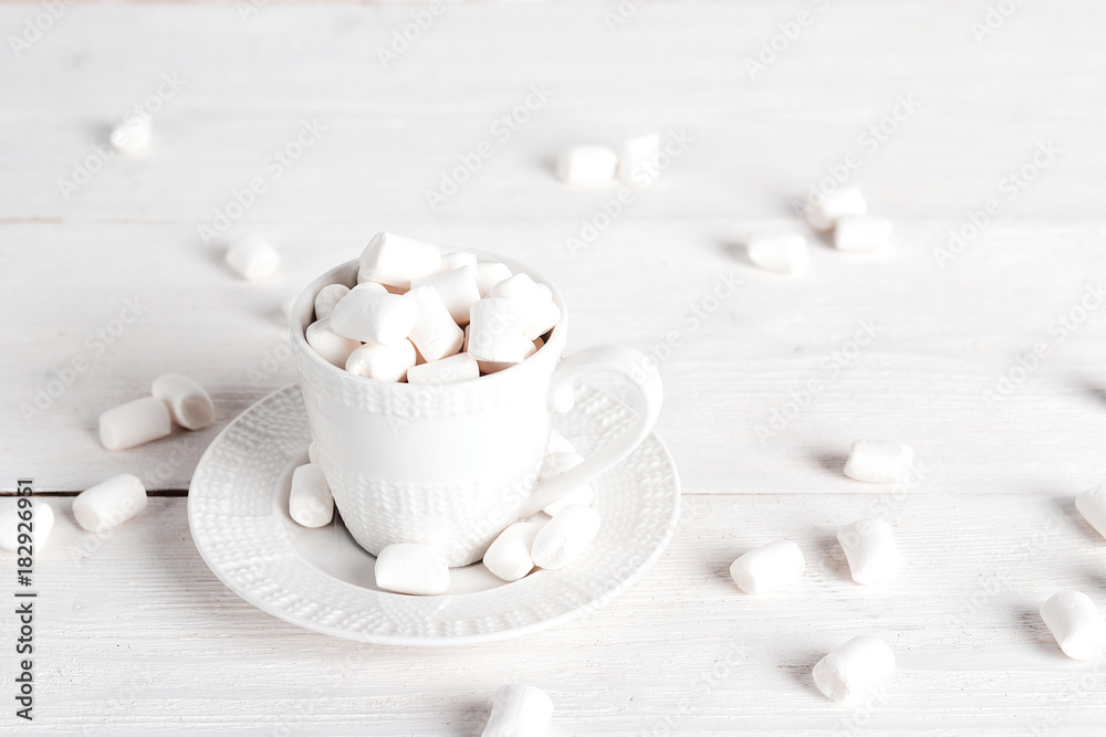 White cup with marshmallows. White cup with marshmallows.
