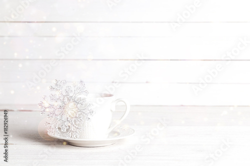 Winter drink with Christmas decoration snowflake. Copy space.