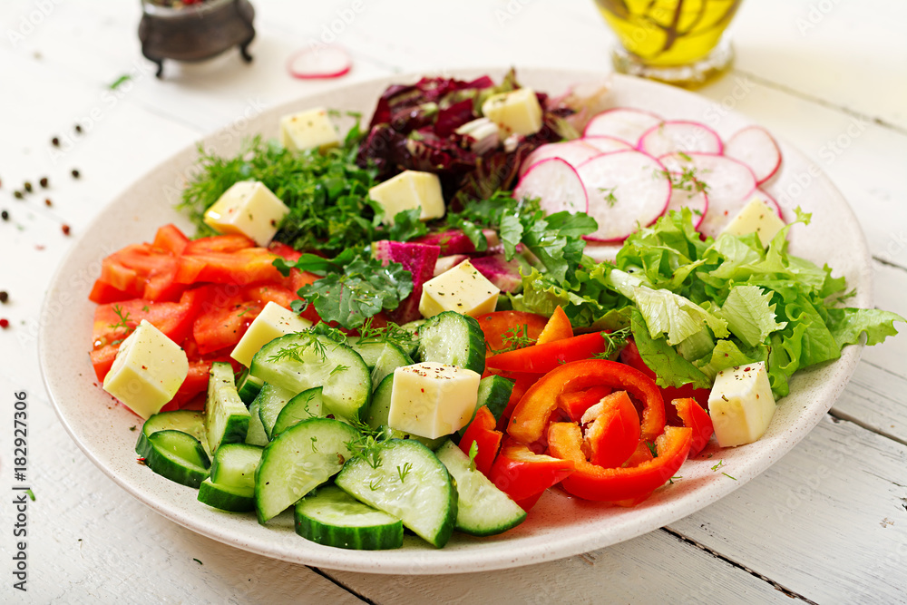 Mix salad from fresh vegetables and greens herbs. Dietary menu. Proper nutrition. Healthy lifestyle.