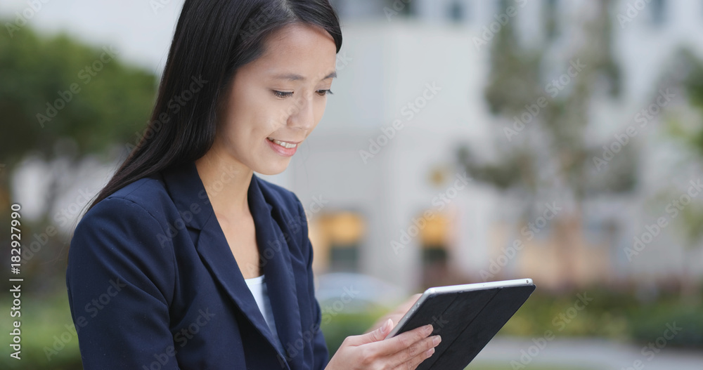 Businesswoman use of tablet computer at night Businesswoman use of tablet computer at night