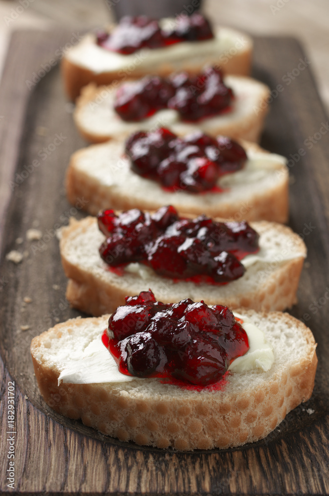 Sandwiches with butter and cranberry jam Sandwiches with butter and cranberry jam