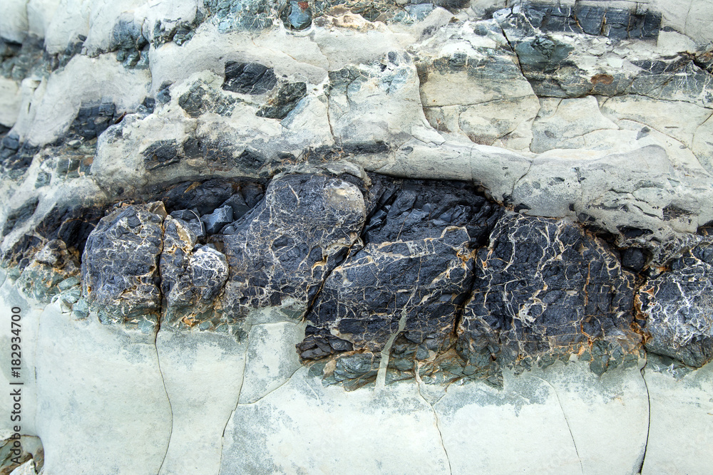 Naklejka premium Stone texture background/Detail of sand stone texture/Natural slate stone background texture/Stone abstract background/Colorful natural stone background/Rock texture and background/Stone/