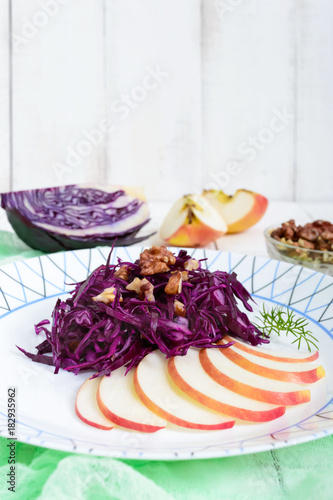 Light diet vegan salad of red cabbage, apple and walnuts. The Lenten dish. Proper nutrition.