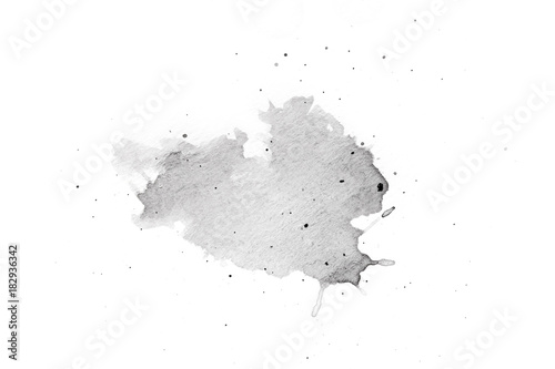 abstract black splashes on white watercolor paper. monochrome image.