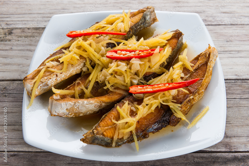 Deep fried fish with ginger and soy sauce Deep fried fish with ginger and soy sauce