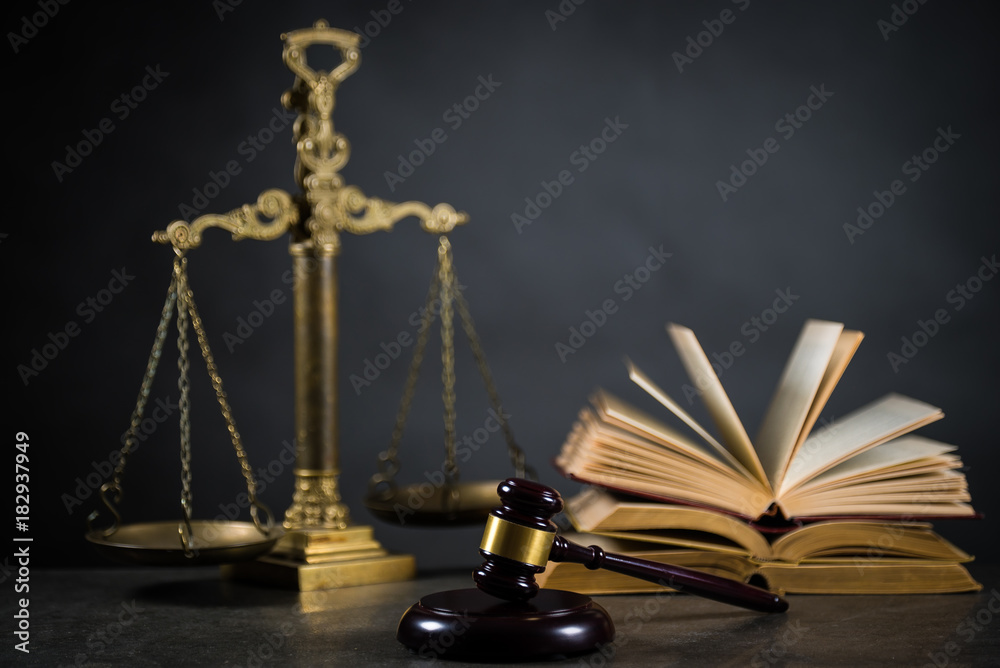 Golden scales of justice, gavel and books on brown background, Law code Golden scales of justice, gavel and books on brown background, Law code