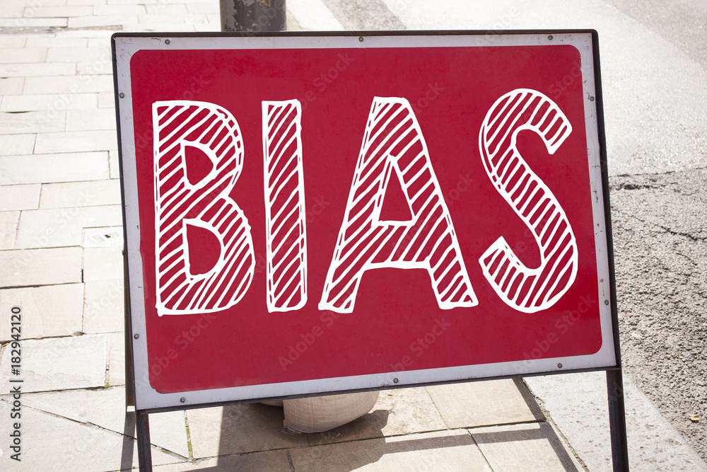 Obraz premium Conceptual hand writing text caption inspiration showing Bias. Business concept for Prejudice Biased Unfair Treatment written on announcement road sign with background and copy space