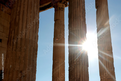 Parthenon temple on the Acropolis of Athens with lights go through, Greece photo