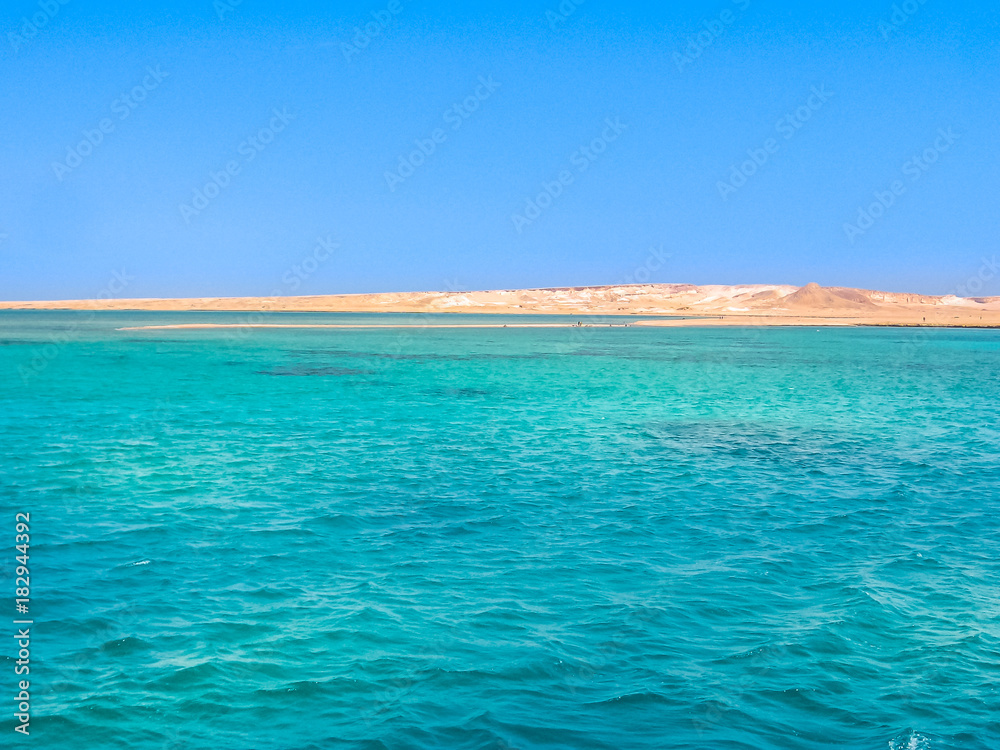 Background of Sharm el Sheikh, Sinai Peninsula, Egypt. Blue sea of Ras Mohammed National Park with its clear and transparent waters and its famous reef. Copy space. Summer holidays. Horizontal shot.