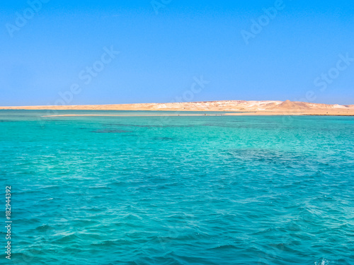 Background of Sharm el Sheikh, Sinai Peninsula, Egypt. Blue sea of Ras Mohammed National Park with its clear and transparent waters and its famous reef. Copy space. Summer holidays. Horizontal shot.