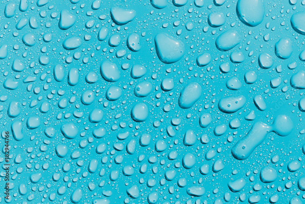 Surface with water drops, light blue background Surface with water drops, light blue background